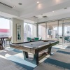 large clubroom with a pool table and chairs